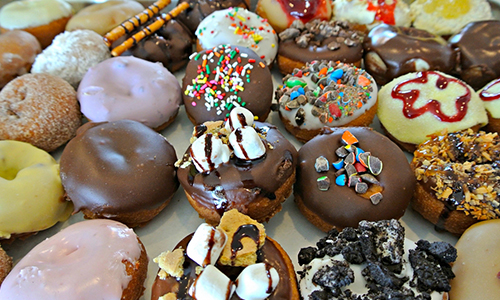 different kinds of doughnuts on a counter
