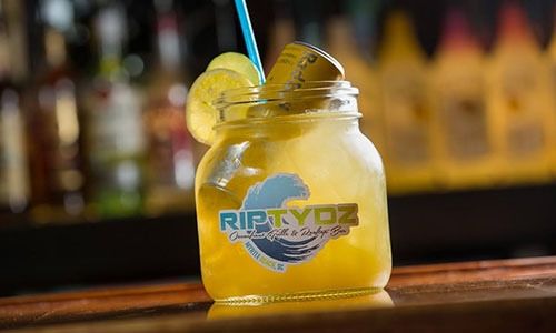 yellow cocktail with red bull from Riptydz Restaurant happy hour menu