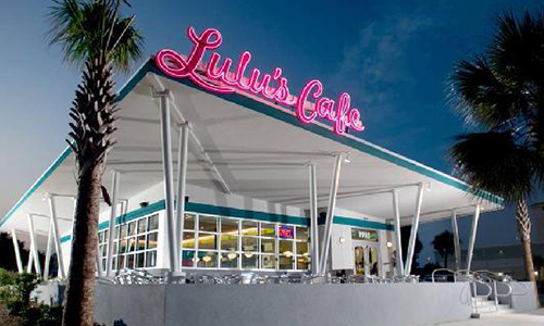 Breakfast restuarnt structure painted white with Lulu Cafe logo on roof