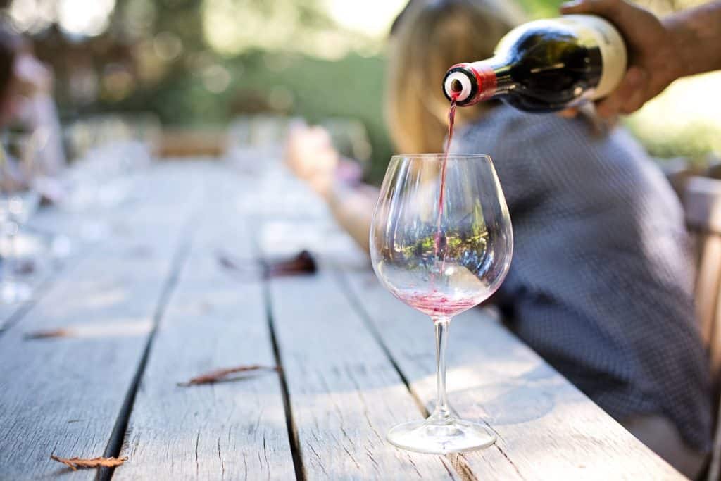 wine getting poured into glass