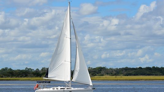 Sailboat floating down the water