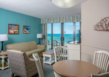 Oceanfront Deluxe Queen Suite Dining & Living Room